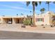 Front view of a single level home with carport and desert landscaping at 7714 E Mariposa Dr, Scottsdale, AZ 85251