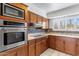 Updated kitchen featuring stainless steel appliances and wood cabinets at 7714 E Mariposa Dr, Scottsdale, AZ 85251