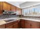 Kitchen with stainless steel appliances and wood cabinets at 7714 E Mariposa Dr, Scottsdale, AZ 85251