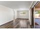 Bright living room with wood-look floors and access to patio at 7714 E Mariposa Dr, Scottsdale, AZ 85251