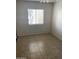 Spacious bedroom with tiled floors and window at 8883 N 48Th Dr, Glendale, AZ 85302