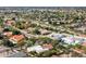 High aerial showcasing mature landscaping and diverse architectural home styles in a desert community at 9504 E Sunnyside Dr, Scottsdale, AZ 85260