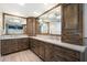 Bathroom with dual vanities, wood cabinets, and ample counter space at 9504 E Sunnyside Dr, Scottsdale, AZ 85260