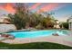 Gorgeous backyard swimming pool surrounded by mature trees and lush landscaping for added privacy at 9504 E Sunnyside Dr, Scottsdale, AZ 85260