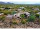 Aerial view showcasing an elegant home with lush desert surroundings at 10040 E Happy Valley Rd # 300, Scottsdale, AZ 85255