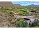 Desert home with large windows, a private pool, and native landscaping at 10040 E Happy Valley Rd # 300, Scottsdale, AZ 85255
