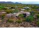 Aerial shot highlighting a luxurious home and beautifully landscaped grounds at 10040 E Happy Valley Rd # 300, Scottsdale, AZ 85255
