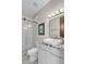 Bright bathroom with a glass shower enclosure, marble counters, and white shaker cabinets at 10040 E Happy Valley Rd # 300, Scottsdale, AZ 85255