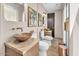 Bathroom with bowl sinks, granite counters, large mirrors, and unique lighting fixtures at 10040 E Happy Valley Rd # 300, Scottsdale, AZ 85255