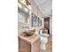 Bathroom with bowl sinks, granite counters, large mirrors, and unique lighting fixtures at 10040 E Happy Valley Rd # 300, Scottsdale, AZ 85255