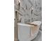 Contemporary white soaking tub complemented by stylish fixtures and marble walls at 10040 E Happy Valley Rd # 300, Scottsdale, AZ 85255