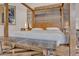Luxurious bedroom with a four-poster bed, upholstered headboard, and modern bench at 10040 E Happy Valley Rd # 300, Scottsdale, AZ 85255