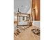 Bedroom with a four-poster bed, wood floors, stone fireplace, and artistic decor at 10040 E Happy Valley Rd # 300, Scottsdale, AZ 85255