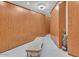 Spacious walk-in closet featuring custom wood cabinets and a comfortable bench at 10040 E Happy Valley Rd # 300, Scottsdale, AZ 85255
