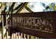 Elegant metal sign for Desert Highlands Golf Club against a backdrop of desert vegetation at 10040 E Happy Valley Rd # 300, Scottsdale, AZ 85255