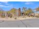 Inviting single-story home with stone accents and manicured shrubs at 10040 E Happy Valley Rd # 300, Scottsdale, AZ 85255