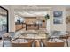 Open-concept kitchen with modern island, stainless steel appliances, and a clear glass dining table at 10040 E Happy Valley Rd # 300, Scottsdale, AZ 85255
