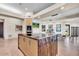 Gourmet kitchen island featuring stone countertop and pendant lights, perfect for entertaining at 10040 E Happy Valley Rd # 300, Scottsdale, AZ 85255
