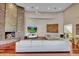 Spacious living room with high ceiling, stone fireplace and plenty of seating at 10040 E Happy Valley Rd # 300, Scottsdale, AZ 85255