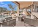 Inviting patio space with a fire pit, lounge furniture, and scenic views of the pool and lush landscaping at 10040 E Happy Valley Rd # 300, Scottsdale, AZ 85255