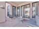 Cozy outdoor patio seating area with comfortable chairs, perfect for relaxing and enjoying the fresh air at 10040 E Happy Valley Rd # 300, Scottsdale, AZ 85255