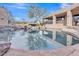 Beautiful pool with rock features mirroring the sky and surrounding landscape, creating a serene oasis at 10040 E Happy Valley Rd # 300, Scottsdale, AZ 85255