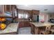 Spacious kitchen featuring granite countertops and dark wood cabinets at 1028 E Emerald Ave, Mesa, AZ 85204