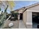 Charming home featuring desert landscaping with native plants and a covered entryway leading to a convenient attached garage at 10705 W Montecito Ave, Phoenix, AZ 85037