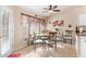 Kitchen nook with round table and four chairs, near sliding glass door at 10729 W Laurelwood Ln, Avondale, AZ 85392