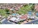 Aerial view of community clubhouse, pool, golf course, and tennis courts at 11132 E Bellflower Ct, Sun Lakes, AZ 85248