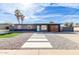 Modern single story home with gray exterior, updated garage door, and landscaped lawn at 1203 E Marny Rd, Tempe, AZ 85288