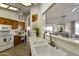 Kitchen features a double sink and views into the living room at 12218 S Shoshoni Dr, Phoenix, AZ 85044