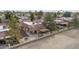 Single-story home featuring desert landscaping, fenced-in backyard with covered patio, and mountain views in a desert community at 12218 S Shoshoni Dr, Phoenix, AZ 85044