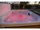 Relaxing hot tub with colorful lighting, perfect for unwinding in a private backyard setting at 12743 W Highland Ave, Litchfield Park, AZ 85340