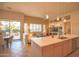 Bright open-concept living space with a modern kitchen island and inviting living area at 12743 W Highland Ave, Litchfield Park, AZ 85340