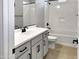 Bathroom with gray vanity, single sink, and bathtub at 15787 W Mariposa Grande --, Surprise, AZ 85387