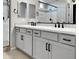 Double vanity bathroom with modern gray cabinets and black fixtures at 15787 W Mariposa Grande --, Surprise, AZ 85387