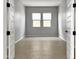 Simple bedroom with light gray walls and tile flooring at 15787 W Mariposa Grande --, Surprise, AZ 85387