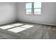 Bright bedroom with carpet flooring and two large windows at 15787 W Mariposa Grande --, Surprise, AZ 85387