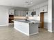 Modern kitchen with gray cabinets, granite counters, and black faucet at 15787 W Mariposa Grande --, Surprise, AZ 85387