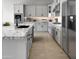 Modern kitchen with granite countertops and stainless steel appliances at 15787 W Mariposa Grande --, Surprise, AZ 85387