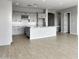 Modern kitchen with gray cabinets and granite island at 15787 W Mariposa Grande --, Surprise, AZ 85387