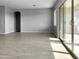 Bright living room with tile floors and sliding glass doors at 15787 W Mariposa Grande --, Surprise, AZ 85387