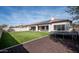 Spacious backyard features artificial turf, desert landscaping, solar panels, and outdoor recreational equipment at 1723 W Brianna Rd, Phoenix, AZ 85085