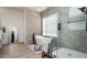 Bright bathroom features walk in shower, soaking tub and modern fixtures at 1723 W Brianna Rd, Phoenix, AZ 85085