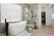 Bright bathroom features walk in shower, soaking tub and modern fixtures at 1723 W Brianna Rd, Phoenix, AZ 85085