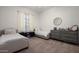 Bedroom with two beds, carpeted floors, and furniture at 1723 W Brianna Rd, Phoenix, AZ 85085