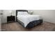 Bedroom with bed featuring a gray headboard, side tables, and lamps at 1723 W Brianna Rd, Phoenix, AZ 85085