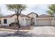 Well maintained single-story home featuring a terracotta roof, three car garage, stucco exterior, and drought-resistant landscaping at 1723 W Brianna Rd, Phoenix, AZ 85085