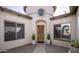 Inviting courtyard showcasing the front door, two windows and a decorative tower element at 1723 W Brianna Rd, Phoenix, AZ 85085